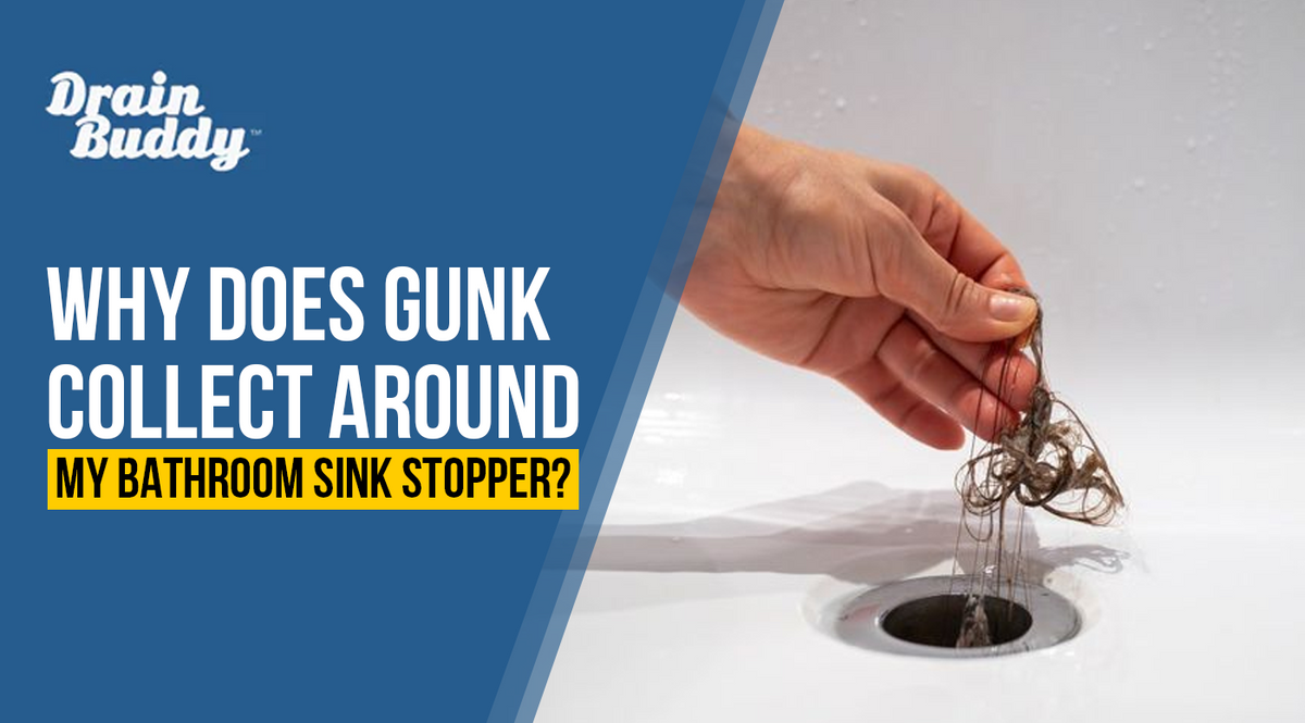 Bathroom sink stopper with hair and gunk buildup around the drain